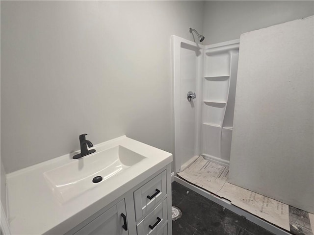 bathroom featuring vanity and walk in shower
