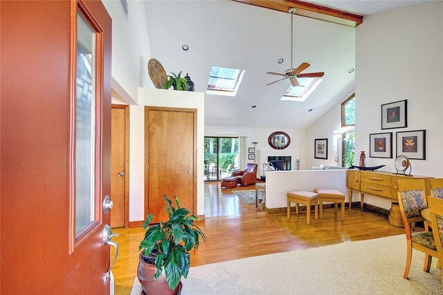 21 Fesser Ave, Bristol, RI 02809 - foyer entrance featuring a skylight, wood finished floors, high vaulted ceiling, and beamed ceiling