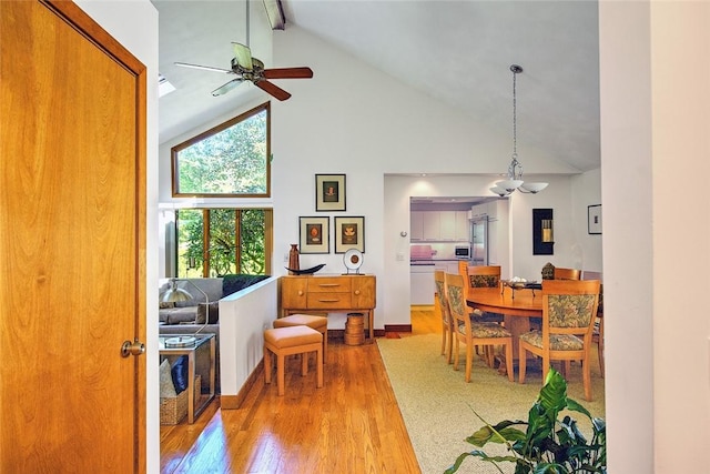 21 Fesser Ave, Bristol, RI 02809 - dining area with high vaulted ceiling, ceiling fan, beam ceiling, and wood finished floors