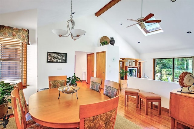 21 Fesser Ave, Bristol, RI 02809 - dining room with beamed ceiling, ceiling fan with notable chandelier, baseboard heating, wood finished floors, and high vaulted ceiling