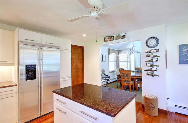 21 Fesser Ave, Bristol, RI 02809 - kitchen featuring tasteful backsplash, a ceiling fan, wood finished floors, stainless steel built in fridge, and baseboard heating