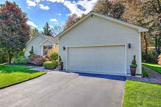 21 Fesser Ave, Bristol, RI 02809 - ranch-style house with a front lawn and a garage