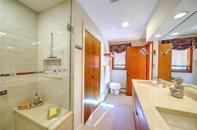 21 Fesser Ave, Bristol, RI 02809 - full bathroom with a baseboard heating unit, a tile shower, tile patterned flooring, and a sink