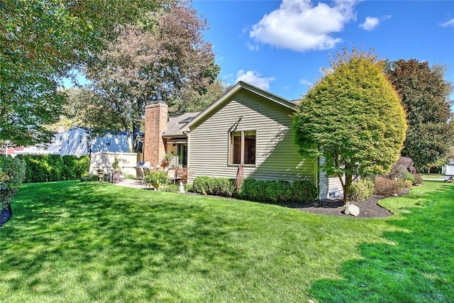 21 Fesser Ave, Bristol, RI 02809 - rear view of property featuring a chimney and a yard