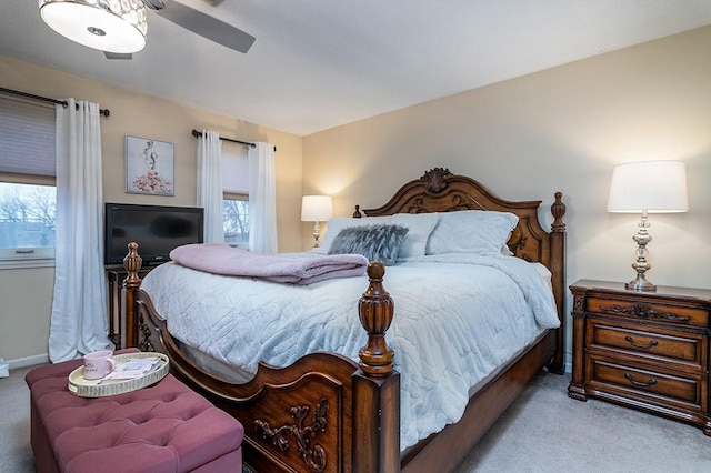 carpeted bedroom featuring ceiling fan and baseboards