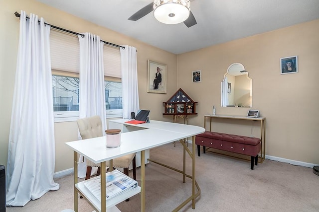 home office featuring baseboards, light colored carpet, and ceiling fan