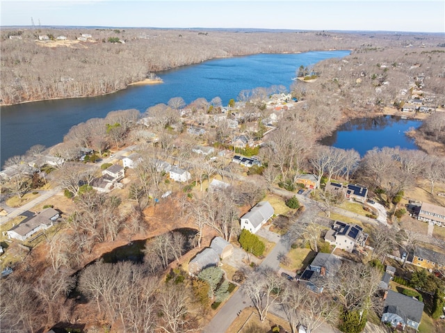 drone / aerial view featuring a water view and a residential view
