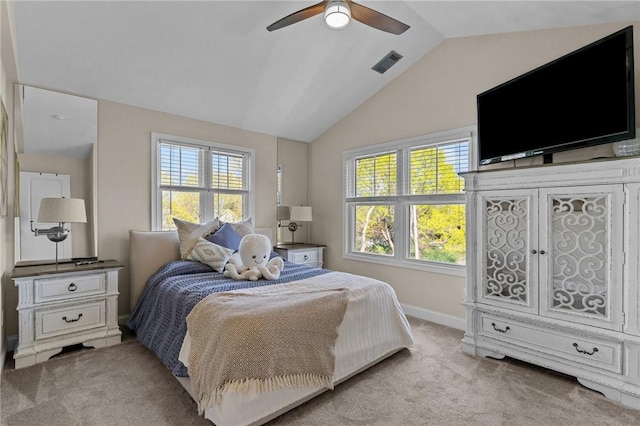 carpeted bedroom featuring baseboards, vaulted ceiling, visible vents, and multiple windows