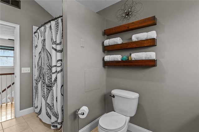bathroom with curtained shower, visible vents, baseboards, toilet, and tile patterned floors
