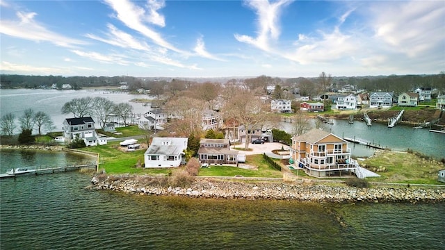 birds eye view of property with a residential view and a water view