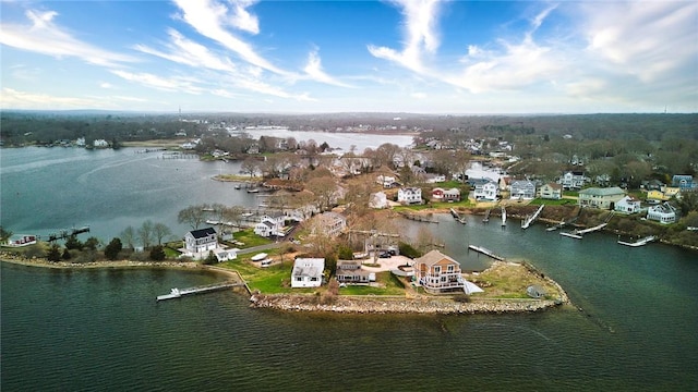 drone / aerial view with a water view and a residential view