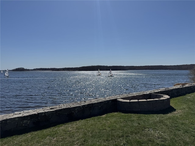 property view of water with a fire pit