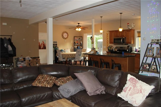 372 Mishnock Rd, West Greenwich, RI 02817 - living area with a ceiling fan and beamed ceiling