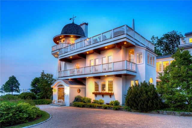 2 Harbor View Dr, Newport, RI 02840 - view of front of home with stucco siding and a balcony