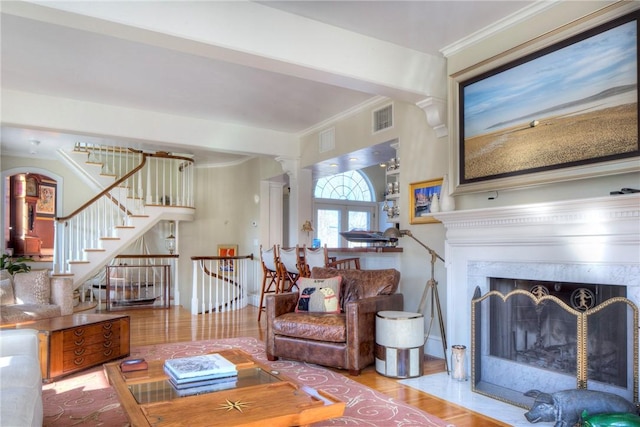 2 Harbor View Dr, Newport, RI 02840 - living room featuring decorative columns, visible vents, wood finished floors, stairway, and crown molding