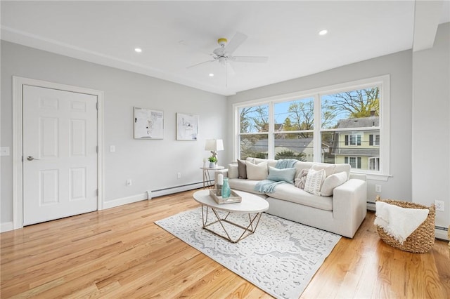 living room with recessed lighting, ceiling fan, wood finished floors, and baseboard heating