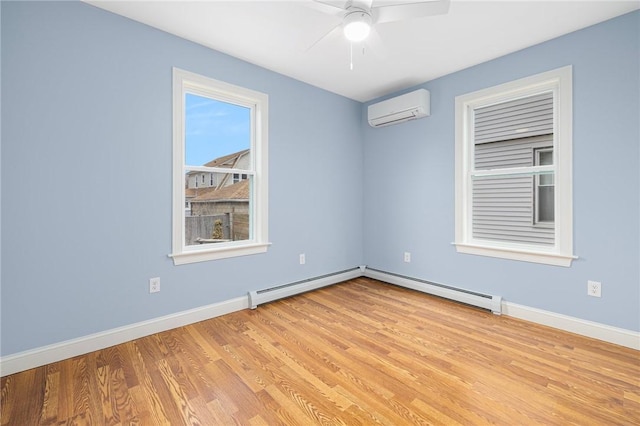 empty room with light wood-type flooring, baseboards, ceiling fan, and a wall mounted AC