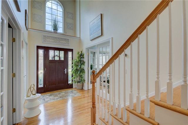 30 Rock Ridge Rd, Westerly, RI 02891 - foyer entrance with a high ceiling, stairs, and light wood-style flooring