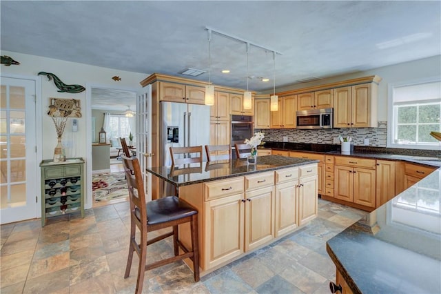 30 Rock Ridge Rd, Westerly, RI 02891 - kitchen with plenty of natural light, a kitchen island, stainless steel appliances, and tasteful backsplash