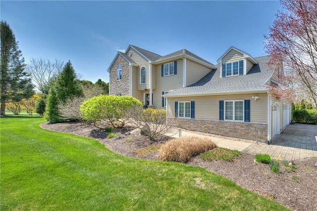 30 Rock Ridge Rd, Westerly, RI 02891 - view of property exterior featuring an attached garage, a shingled roof, a yard, and stone siding