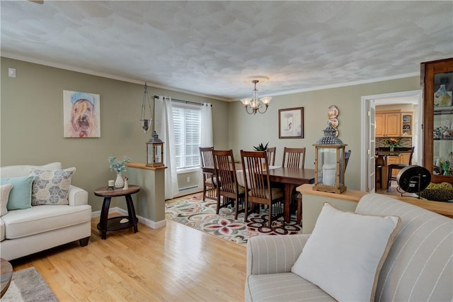 30 Rock Ridge Rd, Westerly, RI 02891 - living area with baseboards, an inviting chandelier, ornamental molding, and light wood-style floors