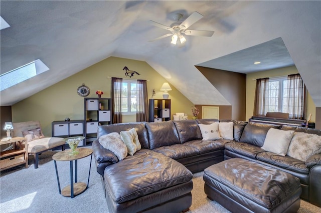 30 Rock Ridge Rd, Westerly, RI 02891 - living area with vaulted ceiling with skylight, a ceiling fan, carpet flooring, and a wealth of natural light