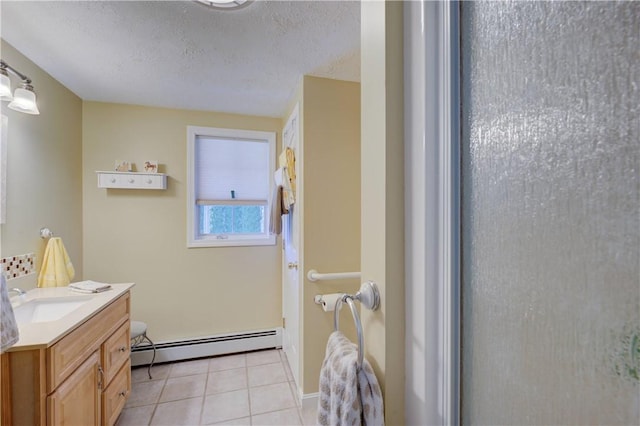 30 Rock Ridge Rd, Westerly, RI 02891 - bathroom with vanity, a baseboard radiator, a textured ceiling, and tile patterned flooring