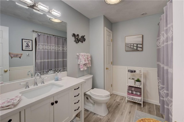 30 Rock Ridge Rd, Westerly, RI 02891 - full bath featuring a wainscoted wall, vanity, toilet, and wood finished floors