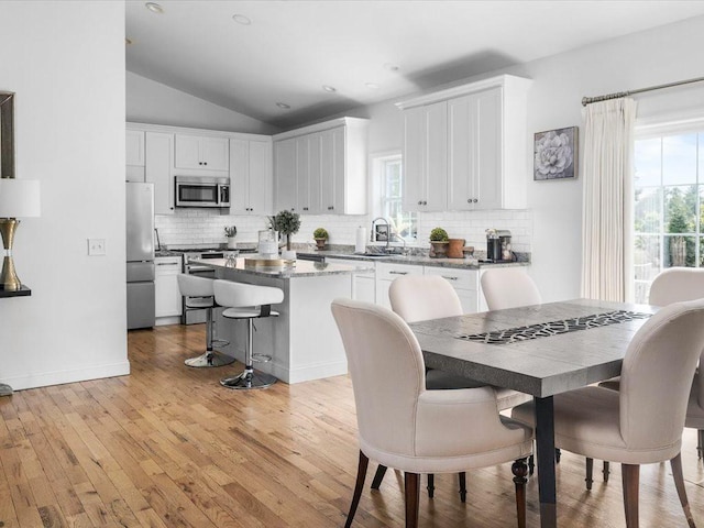 120 S Rd, East Greenwich, RI 02818 - dining room featuring baseboards, vaulted ceiling, light wood finished floors, and recessed lighting