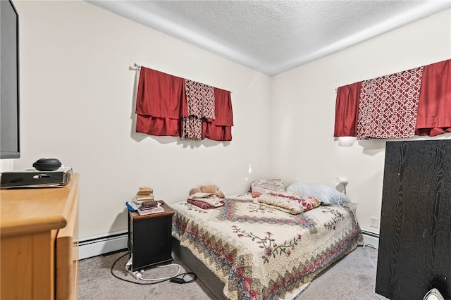 bedroom with a baseboard radiator, carpet floors, and a textured ceiling