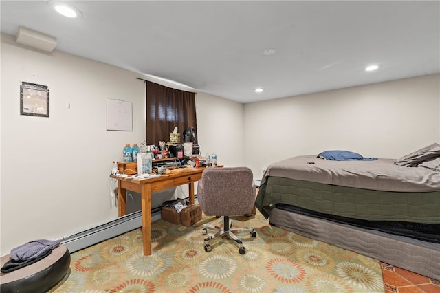 bedroom featuring baseboard heating and recessed lighting