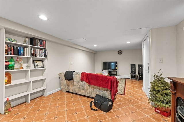 living area featuring recessed lighting, a baseboard radiator, and baseboards