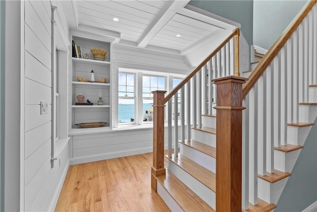 stairs with beamed ceiling, wood finished floors, wood ceiling, and recessed lighting