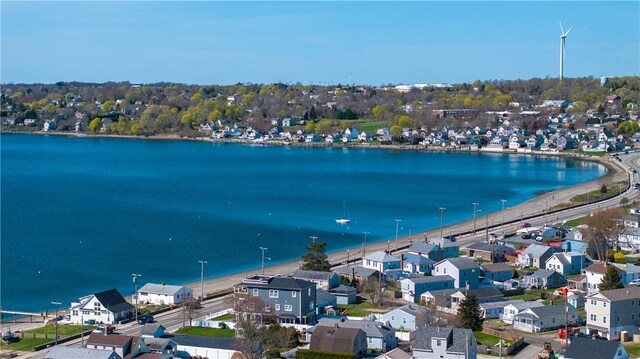 birds eye view of property featuring a residential view and a water view