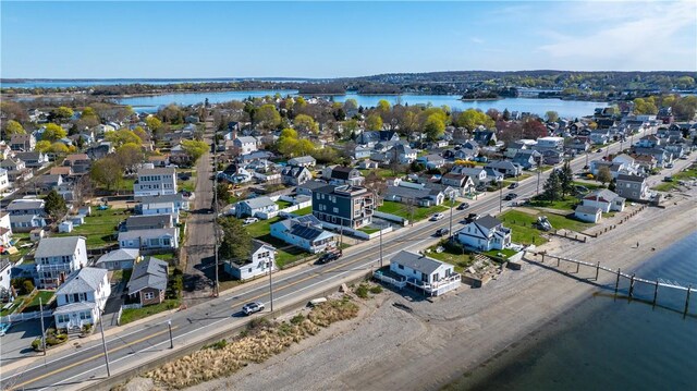 bird's eye view with a water view and a residential view