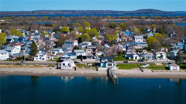 birds eye view of property with a residential view and a water view