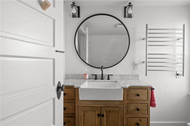 bathroom featuring vanity and radiator