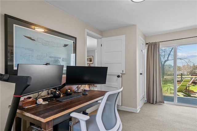 office featuring light carpet and baseboards
