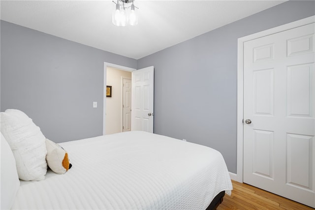 bedroom with wood finished floors