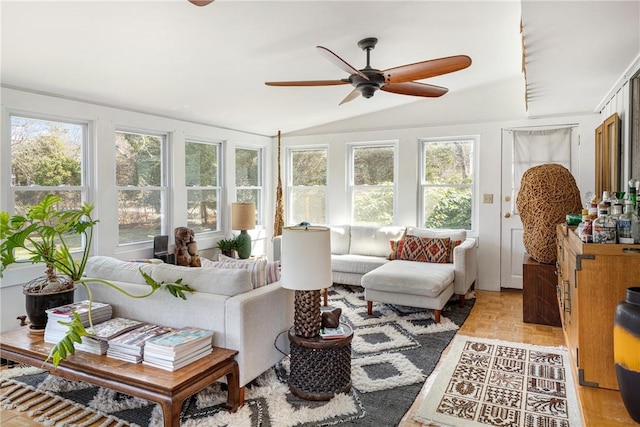 sunroom featuring vaulted ceiling and a healthy amount of sunlight