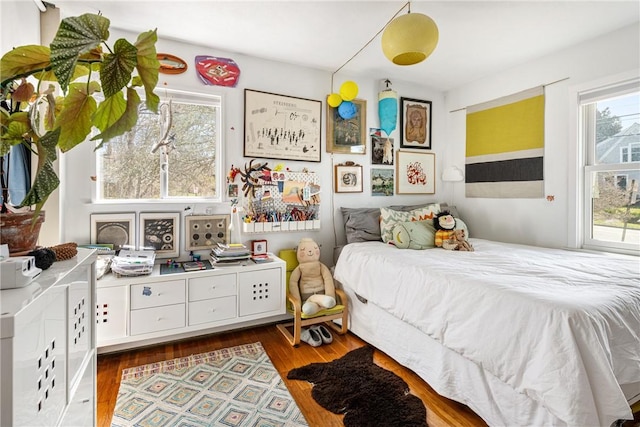 bedroom featuring wood finished floors