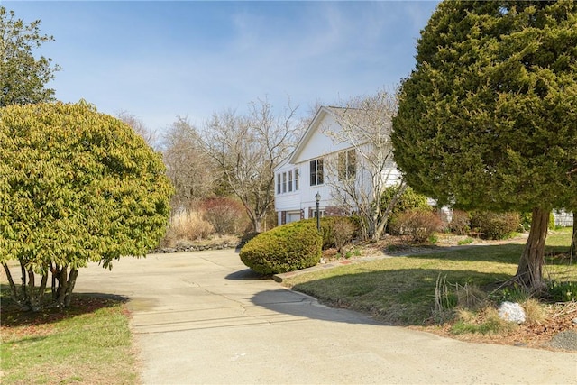 view of side of property featuring a lawn