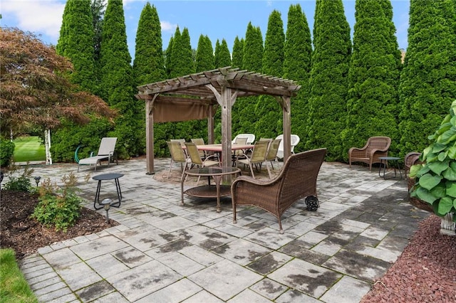 view of patio / terrace with a pergola and outdoor dining area