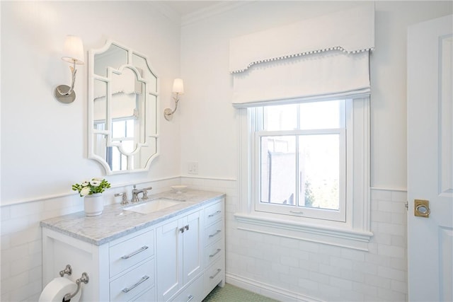 78 Rhode Island Ave Unit 8, Newport, RI 02840 - bathroom with vanity, crown molding, wainscoting, and tile walls