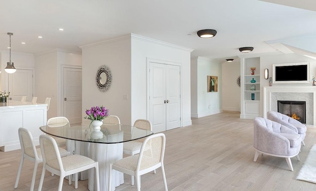 78 Rhode Island Ave Unit 8, Newport, RI 02840 - dining room with recessed lighting, light wood-style floors, built in shelves, crown molding, and baseboards