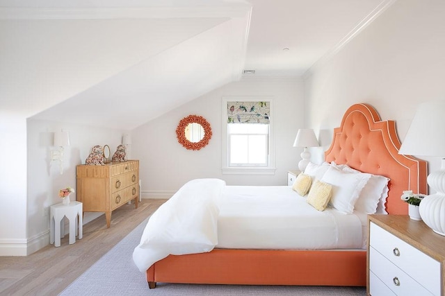 78 Rhode Island Ave Unit 8, Newport, RI 02840 - bedroom with crown molding, visible vents, baseboards, light wood-type flooring, and vaulted ceiling
