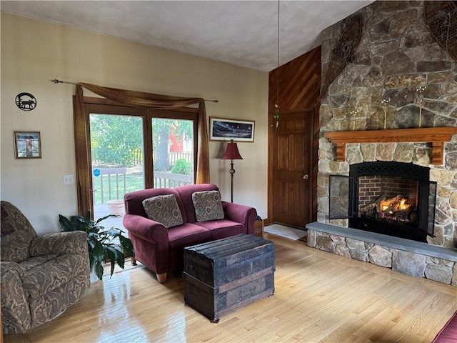living area featuring a fireplace and wood finished floors
