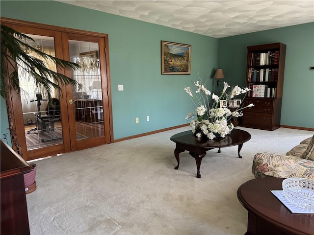 living area with carpet floors and baseboards
