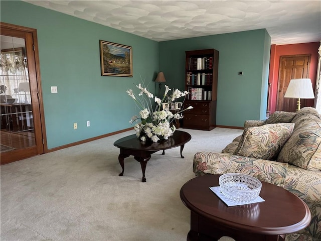 carpeted living room featuring baseboards