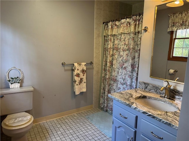 bathroom with toilet, vanity, curtained shower, baseboards, and tile patterned flooring